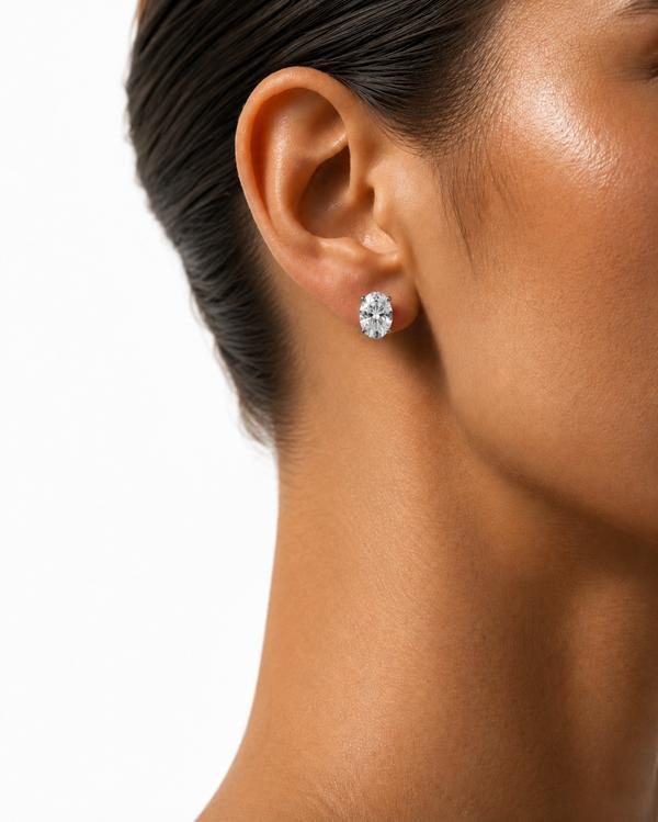 Oval diamond stud, prong set, worn on the ear